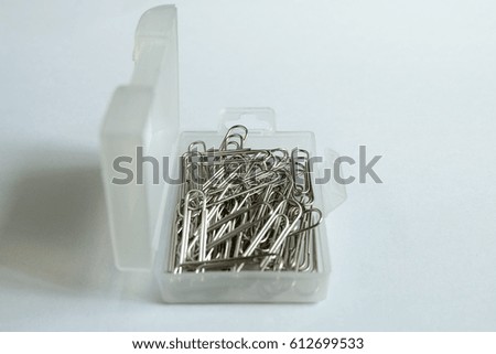 paper clip in a plastic box