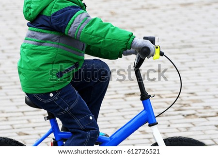 Children's sports entertainment. The image of a child who is riding a children's Bicycle.