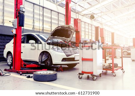 car repair station with soft-focus in the background and over sunlight Royalty-Free Stock Photo #612731900