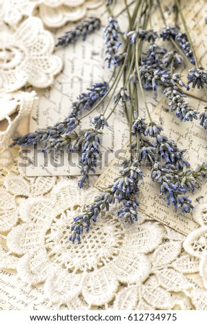 Lavender flowers and vintage love postcards. Retro style toned picture