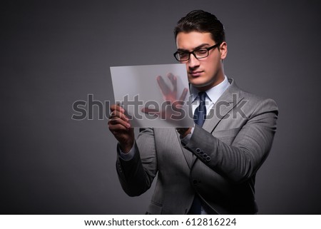 Handsome businessman working on tablet computer
