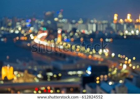 Twilight night view blurred bokeh light Kobe city port downtown, abstract background