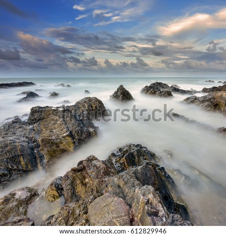 Beautiful nature landscape of Chendering Beach, Pandak , located in Terengganu, Malaysia with unique formation rocks, ( seascape ,Soft focus due to long exposure shot.)