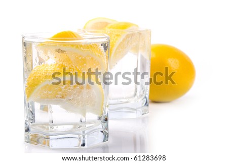 two glasses with soda water and lemon slices