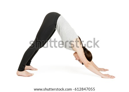 Yoga woman grey Position looking down dog Royalty-Free Stock Photo #612847055