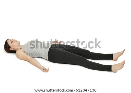 Yoga woman gray_shavasana Royalty-Free Stock Photo #612847130