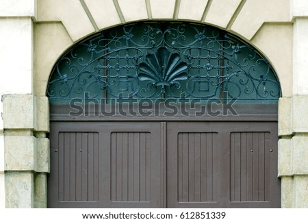 Closeup of wooden gate on building. 