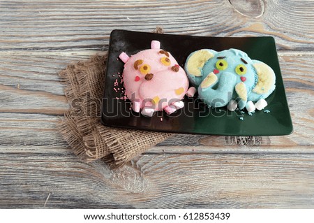 The hippopotamus, elephant are made of ice cream . A creative dessert for children and good mood
