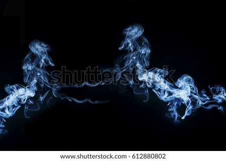   Fluffy Puffs  of Smoke and Fog on Black Background