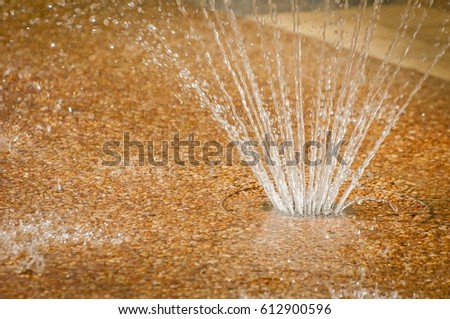 Fountain water sprinkler, water splashing from the ground stock image.