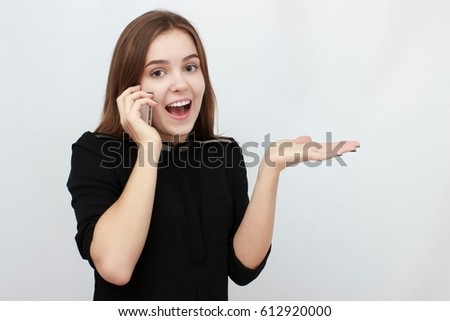 Young Businesswoman on the cell phone isolated on a white background.