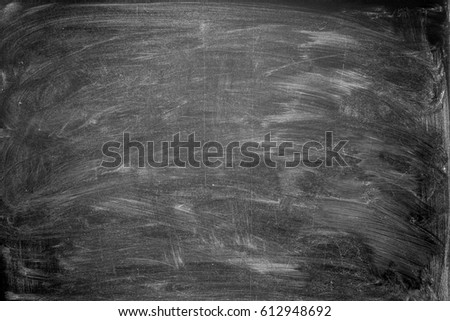 Overhead view of blackboard with smudged chalk.