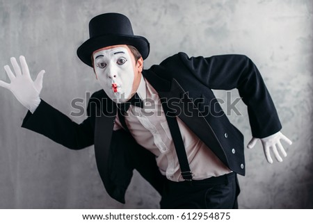 Pantomime theater artist posing, mimic male person Royalty-Free Stock Photo #612954875