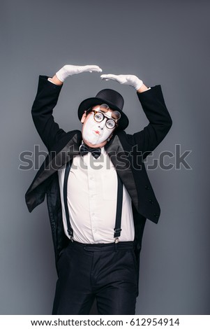 Male mime actor fun mimic performing