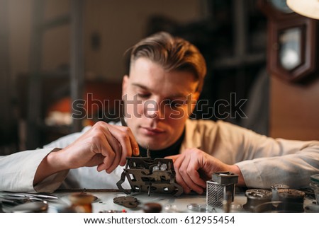 Watchmaker with loupe repair clockwork mechanism