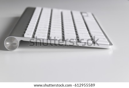 Workplace with computer keyboard on white background