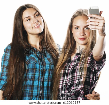cute teenage girls making selfie isolated