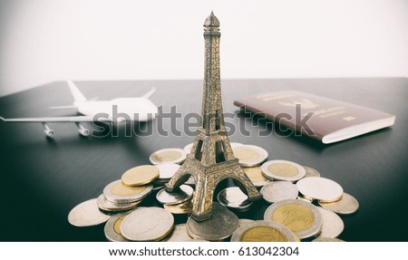 Saving money for Paris vacation travel concept