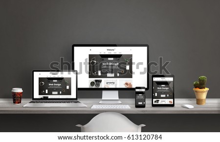 Web design studio with responsive web site promotion. Computer display, laptop, tablet and smart phone mockup on office desk. Plant and coffee beside. Royalty-Free Stock Photo #613120784