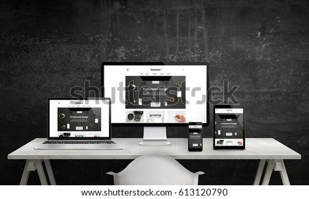 Responsive web site promotion on computer display, laptop, tablet and smart phone. Modern, clean web design. White office desk with devices, black wall in background. Royalty-Free Stock Photo #613120790