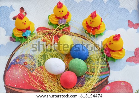 Happy easter. A cheerful holiday picture with chickens and colored eggs.