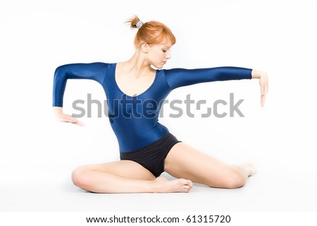 The young beautiful gymnast on training.