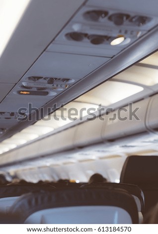 Interior inside of the plane with passengers.