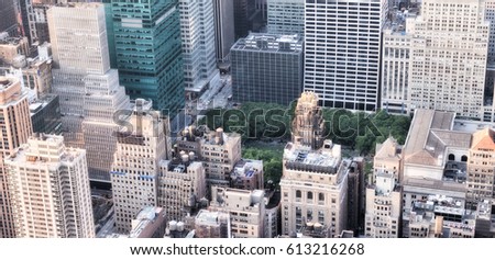 Bryant Park in Manhattan, surrounded by skyscrapers.