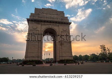 India Gate Delhi - A war memorial on Rajpath road at sunrise. Royalty-Free Stock Photo #613239257