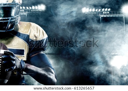 American football sportsman player on stadium with lights on background with copy space