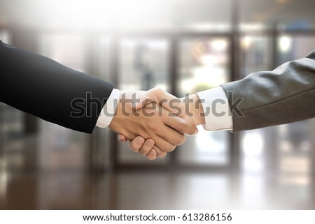 M&A (MERGERS AND ACQUISITIONS) , Businessman handshake working at office M&A Royalty-Free Stock Photo #613286156