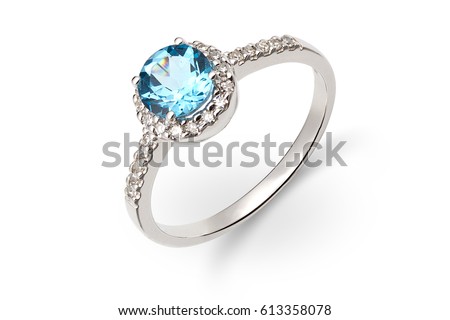 Gold ring with blue and white gem Royalty-Free Stock Photo #613358078