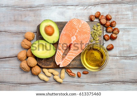 Selection of healthy fat sources. Top view. Royalty-Free Stock Photo #613375460
