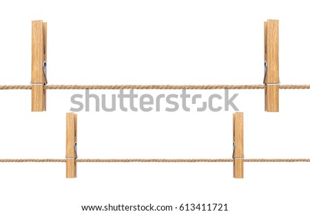 Isolated clothespins. Wooden clothespins on rope isolated on white background with clipping path Royalty-Free Stock Photo #613411721