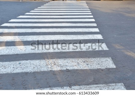zebra crossing sign on road