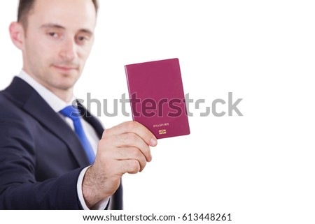 Suit Up Business Man holding universal red passport in right hand isolated on white background