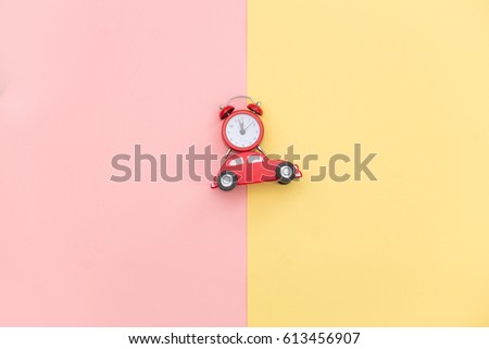 photo of car shaped toy and alarm clock on the wonderful background in pop art style