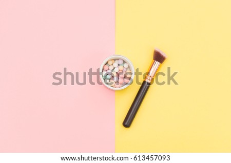 photo of colorful brush and powder on the wonderful background in pop art style