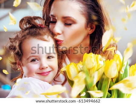 Young mother having fun with her little baby - colorful version of the image