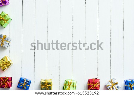 little gift boxes on white wooden table background