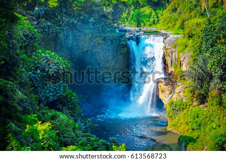 Waterfall hidden in the tropical jungle. Majestic waterfall in the rainforest jungle. Green and clean waterfal