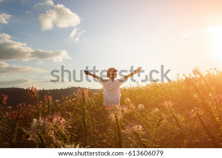 children raise their arms up to the sky. They feel free Royalty-Free Stock Photo #613606079