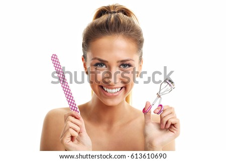 Picture showing woman using eyelash curler over white