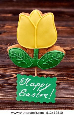Flower cookie, Happy Easter card. Bright biscuit on a stick. Sweet taste of spring.