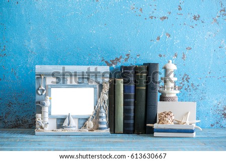 Sea theme decorations. Decorative photo and marine items on wooden background. 