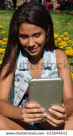 Happy Teen Girl With Tablet