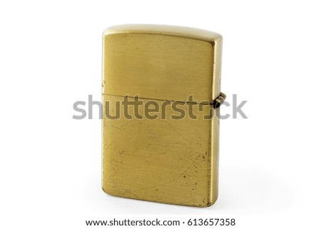 golden metal gasoline lighter isolated on  white background with clipping path.