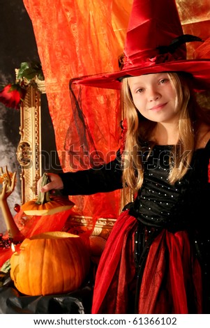 Girl with a Halloween pumpkin Royalty-Free Stock Photo #61366102