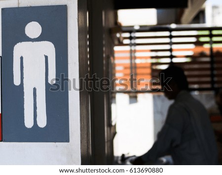 men toilet sign with a man
