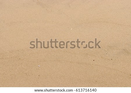 Patterns Texture of sand on the beach Royalty-Free Stock Photo #613716140